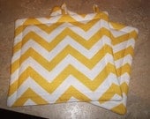 Set of 2 Potholders in Yellow and White Chevron fabric.