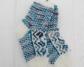 Handknitted norwegian socks in white and many shades of tourqoise