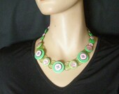 Button necklace, green and pink for International Women's Day.
