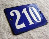 vintage house number, enamel sign white number 210 on blue, from the Netherlands