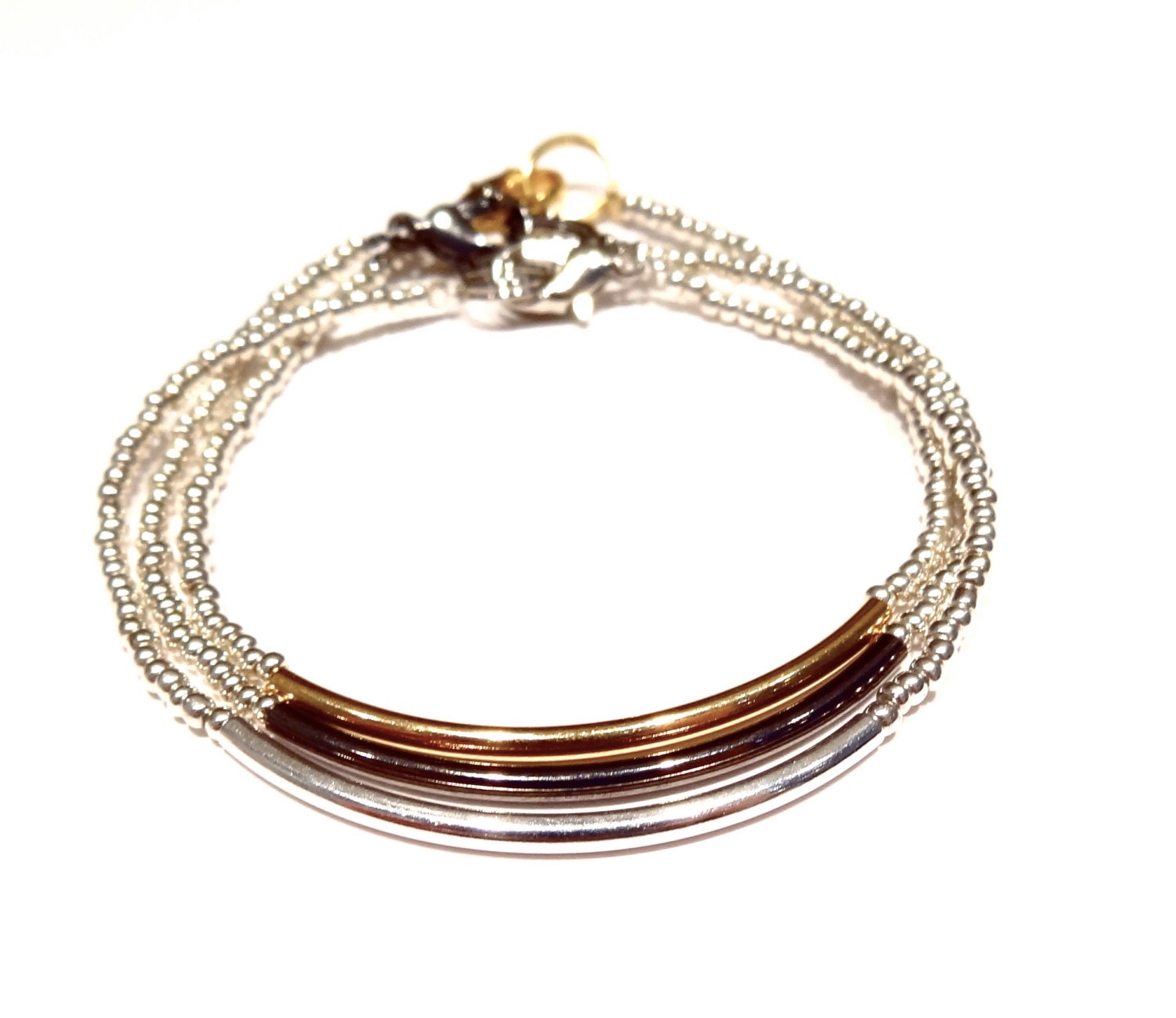 metallic heartlines w silver curved bar // dainty bracelet with cylindrical curved silver bar and shiny silver seed beads