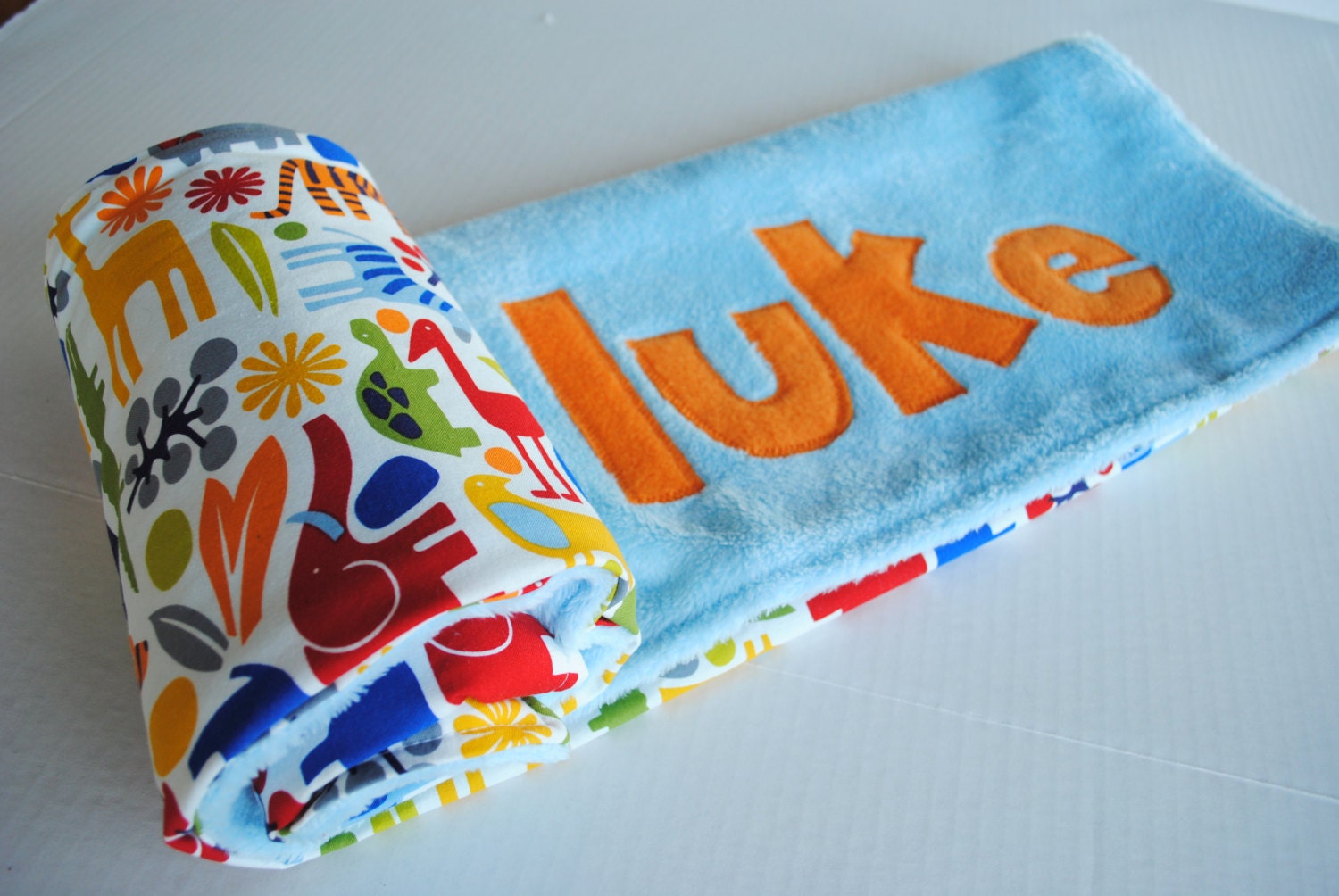 Handmade Personalized Baby Stroller Blanket in 2-D Zoo in Light Blue