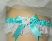Wedding / Bridal garter in satin with Alencon style, fringed lace& a satin bow topped with a white ribbon rose with a rhinestone cent