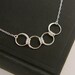 Four linked circles infinity necklace in sterling silver, entwined rings, sterling silver ring, interlocking circles, four circles