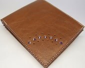 Tan leather wallet with purple stripe lining