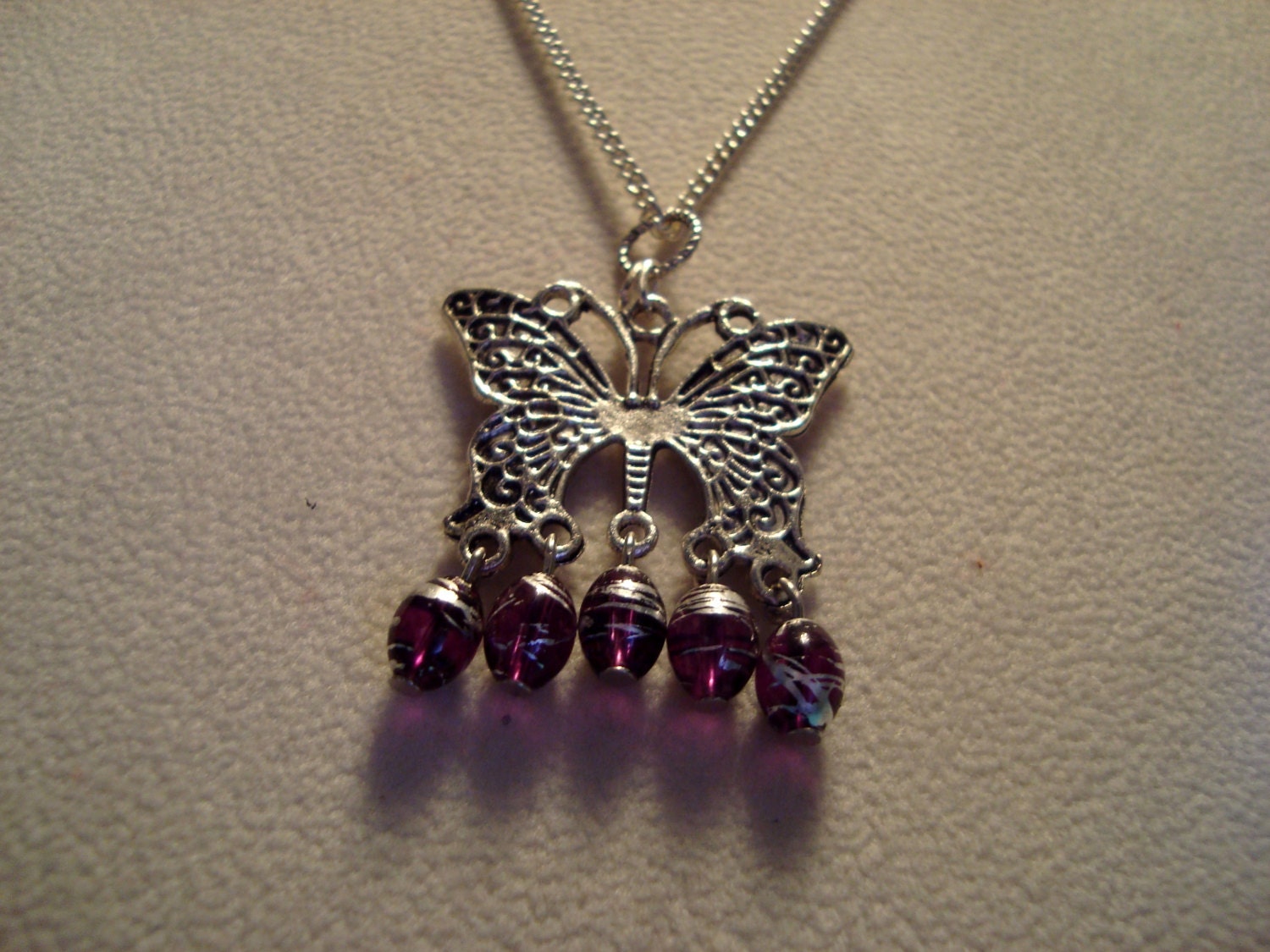 Silver Butterfly Pendant with Silver and Purple Glass Beads
