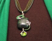 Green Wire wrapped pendant necklace yellow turquoise shamrock silver wire
