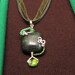 Green Wire wrapped pendant necklace yellow turquoise shamrock silver wire