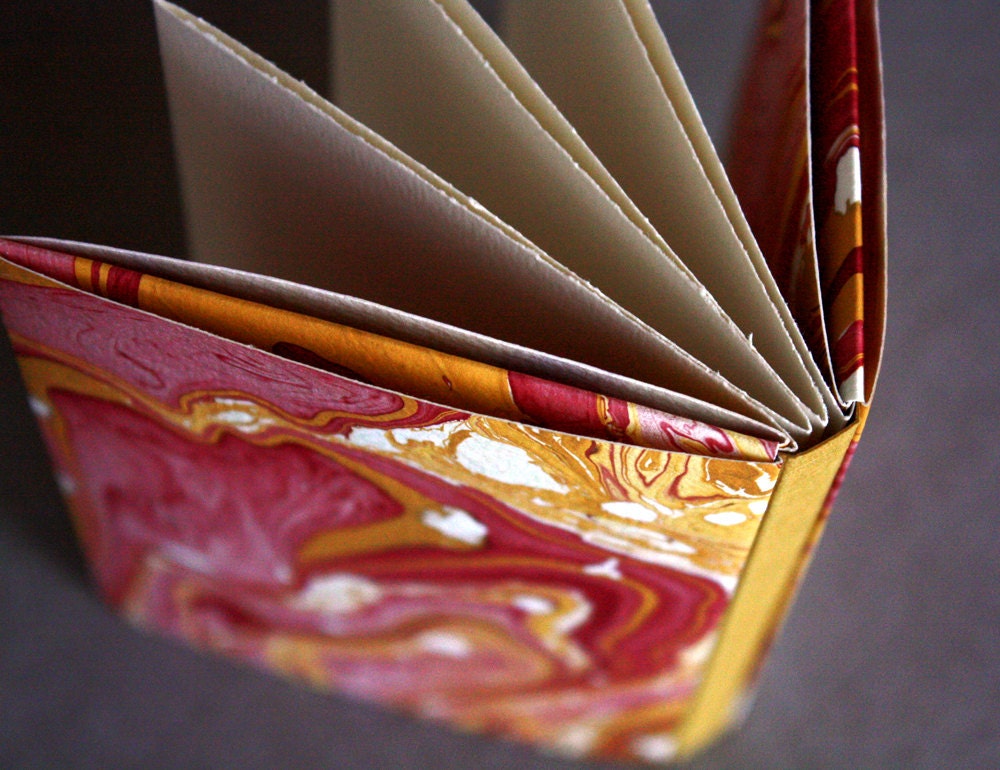 Concertina notebook with pink and yellow marbled paper covers