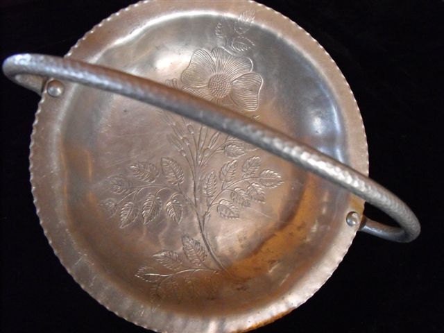Vintage aluminum dish with beautiful flower design and hammered handle