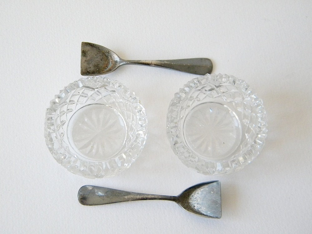 two vintage salt pots with spoons