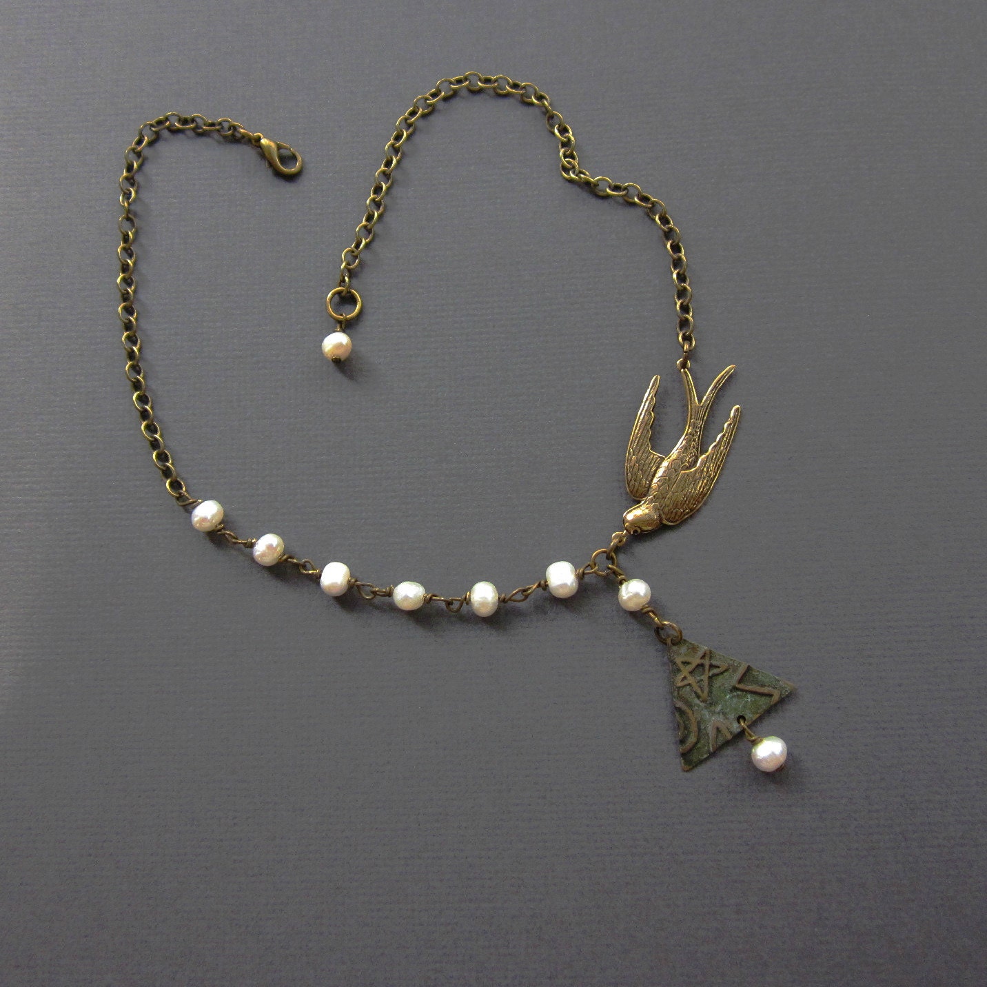 diving bird with pearls on bronze - the yani necklace