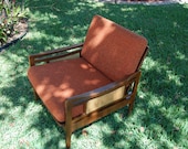 Mid Century Wooden and Cane Chair with Orange Cushion Eames at Retro Daisy Girl