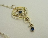 Edwardian Sapphire and Seed Pearl Pendant. Yellow Gold Necklace, 1910s.