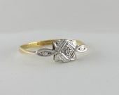 Dainty Art Deco Diamond Ring. Diamond Solitaire in Geometric Design, Circa 1920s.