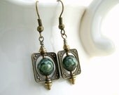 Faceted Green Pearl Earrings in antique brass bead frames - square saturn rings circle around faceted pearls - steampunk jewelry