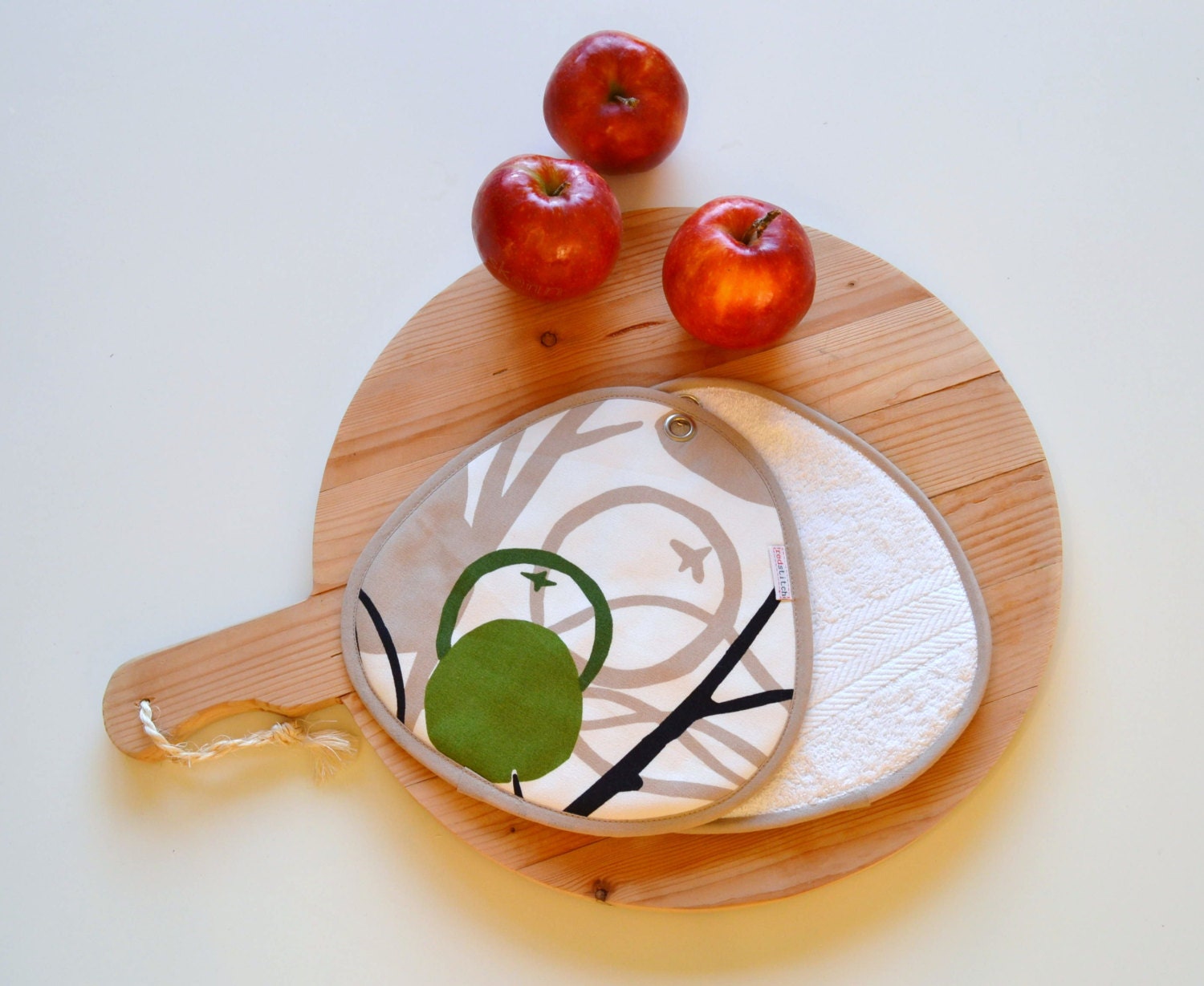 neutral potholders with print in beige and apple green - modern kitchen potholders - fruit