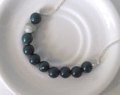 color block bead necklace in dark green and gray