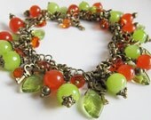 Jewelry set, jewelry, charm bracelet, dangle earrings, drop earrings, green bracelet, orange bracelet