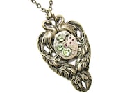 Steampunk Necklace Antiqued Brass Toned Peacock Charm with a Stunning Jeweled Watch Movement By: Mechanique Steampunk