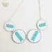Hand embroidered necklace with four arrows in silvertone