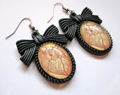 Black anatomical heart dangle earrings