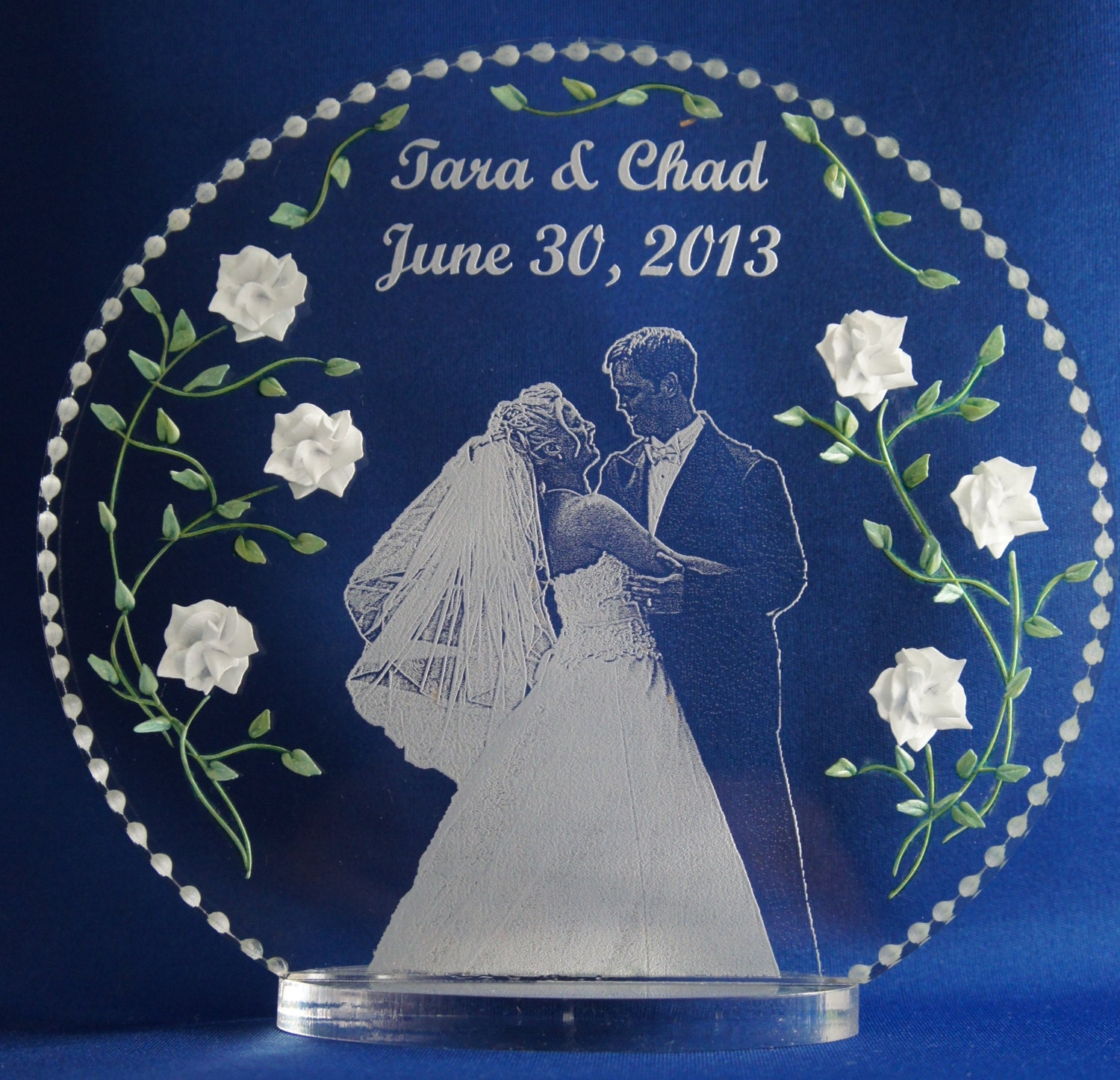 your photo etched with 3D hand engraved flowers acrylic clear glass-like cake topper/gift that celebrates this very special occasion.