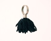 alpaca metal ring with crochet flower in black