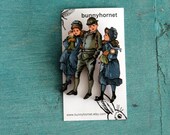Three siblings - 'Abroad' wooden brooch
