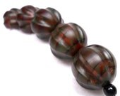 American Trade Bead - Nevada - Strand of 5 ball beads. Hollow blown carved boro glass lampwork.