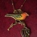 Escape - handmade antiqued vintage chain pendant glass bird with charms