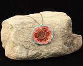 Flower Necklace with Orange and turquoise trim.
