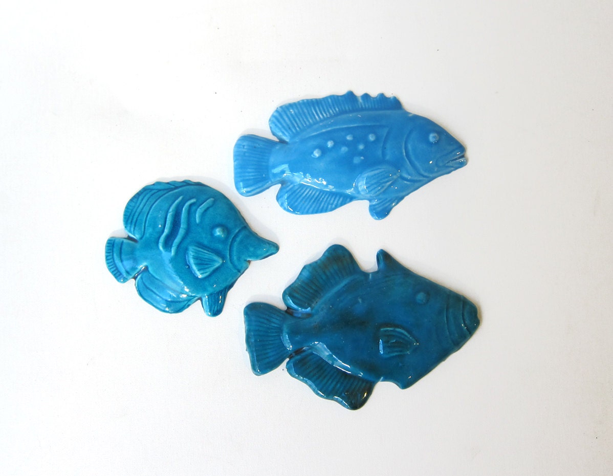 Set of three blue glazed hand crafted artisan ceramic fish wall hanging