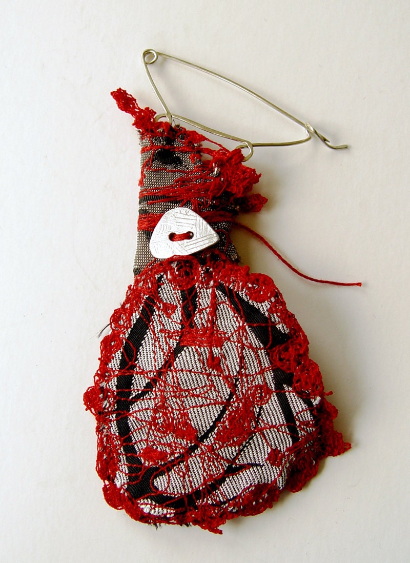 Brooch in red, silver grey and black from the "Playful" series