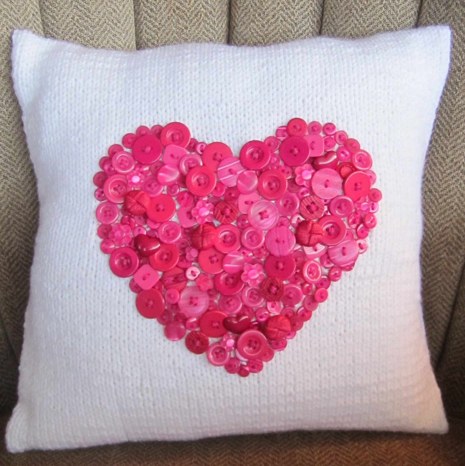 Deep pink button heart motif hand knit pillow