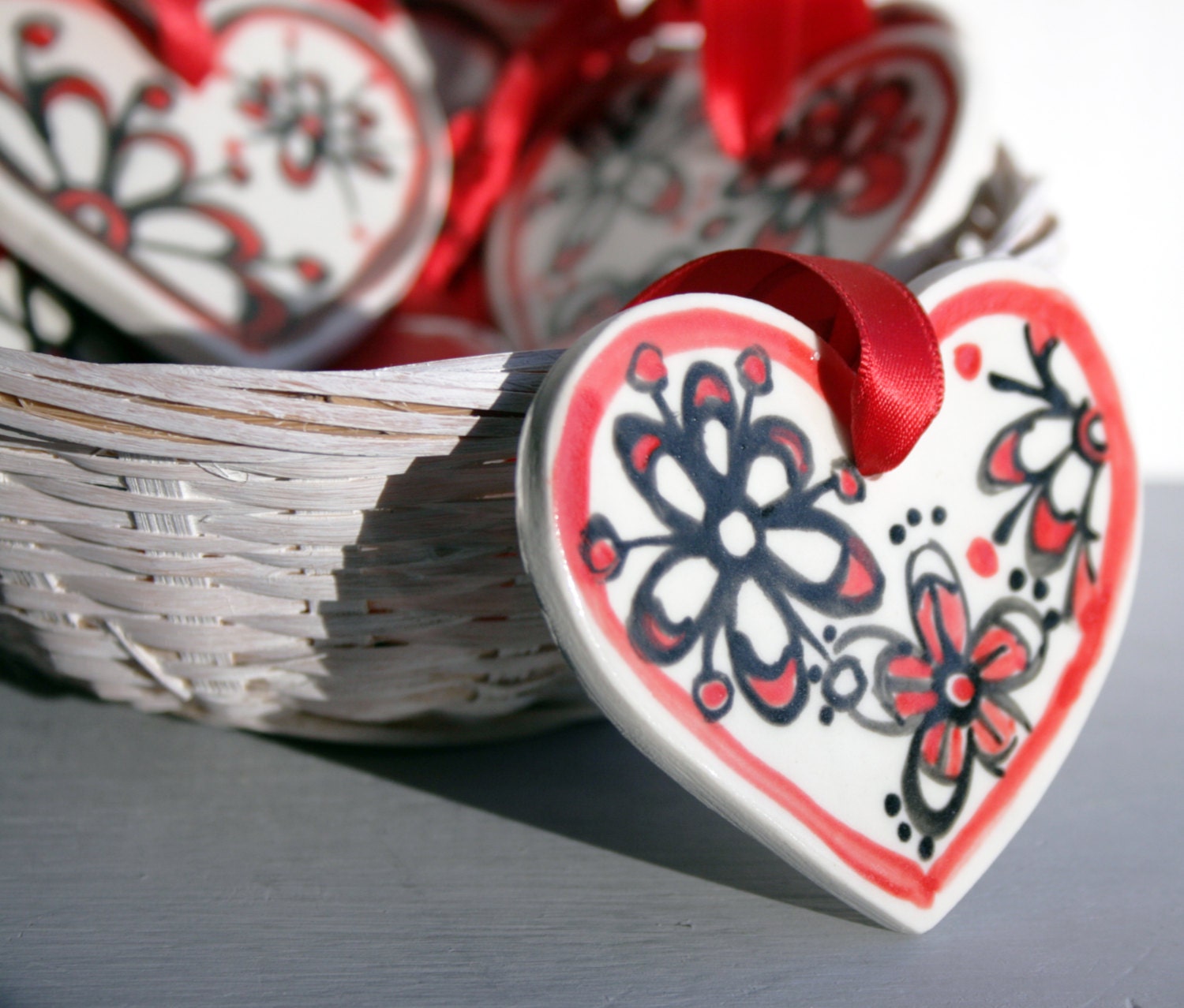 Ceramic Valentines heart hanging with red and black floral decoration