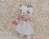 white kitty cloth doll with wool felt tote