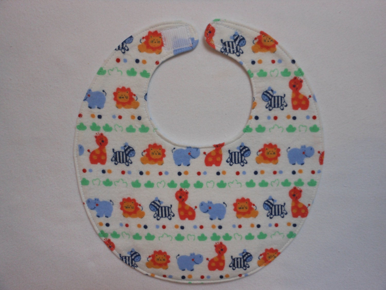 Baby Bibs, four soft layers, reversible, white with blue and orange jungle animals
