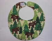 Baby bib, four soft layers, reversible, brown mooses, and green trees.