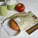pair of reusable, lined sandwich bags in yellow, gray & stripe