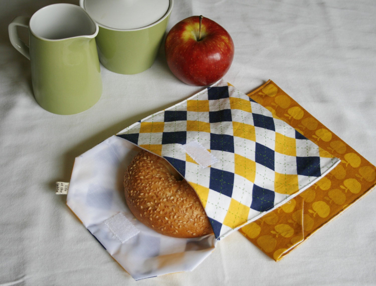 pair of reusable, lined sandwich bags in gold apple & plaid