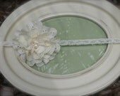 IVORY HEADBAND with ivory eyelet flower with thin, lace, ivory elastic with a pearl center