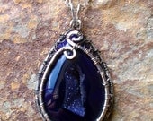 Deep purple druzy cab with sterling silver encased wire wrap