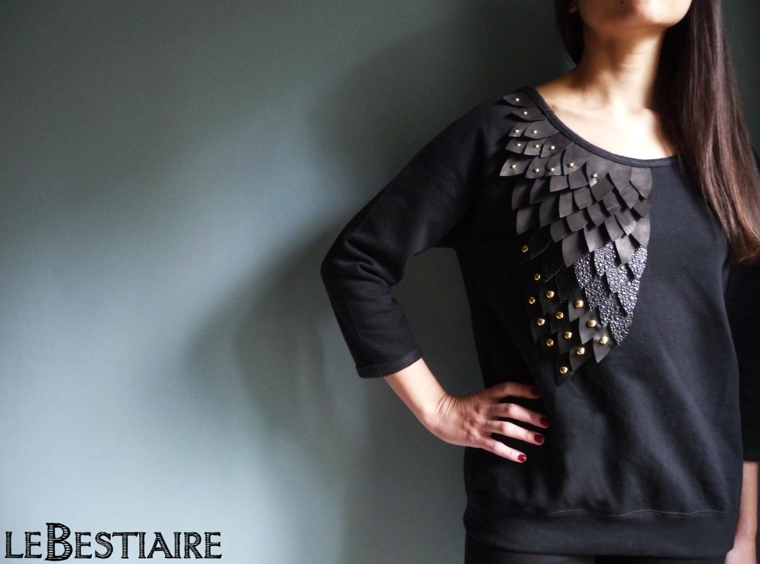 Black cotton sweat shirt embroidered with black leather feathers and studs