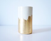 spotted vessel with gold brush strokes