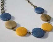 Blue, Yellow, and Natural Color Round Coin Shaped Tagua Nut Necklace with Brass Chain Link