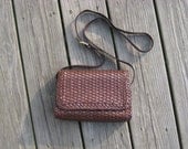 Vintage Talbots small brown  woven leather cross body purse with a long adjustable strap