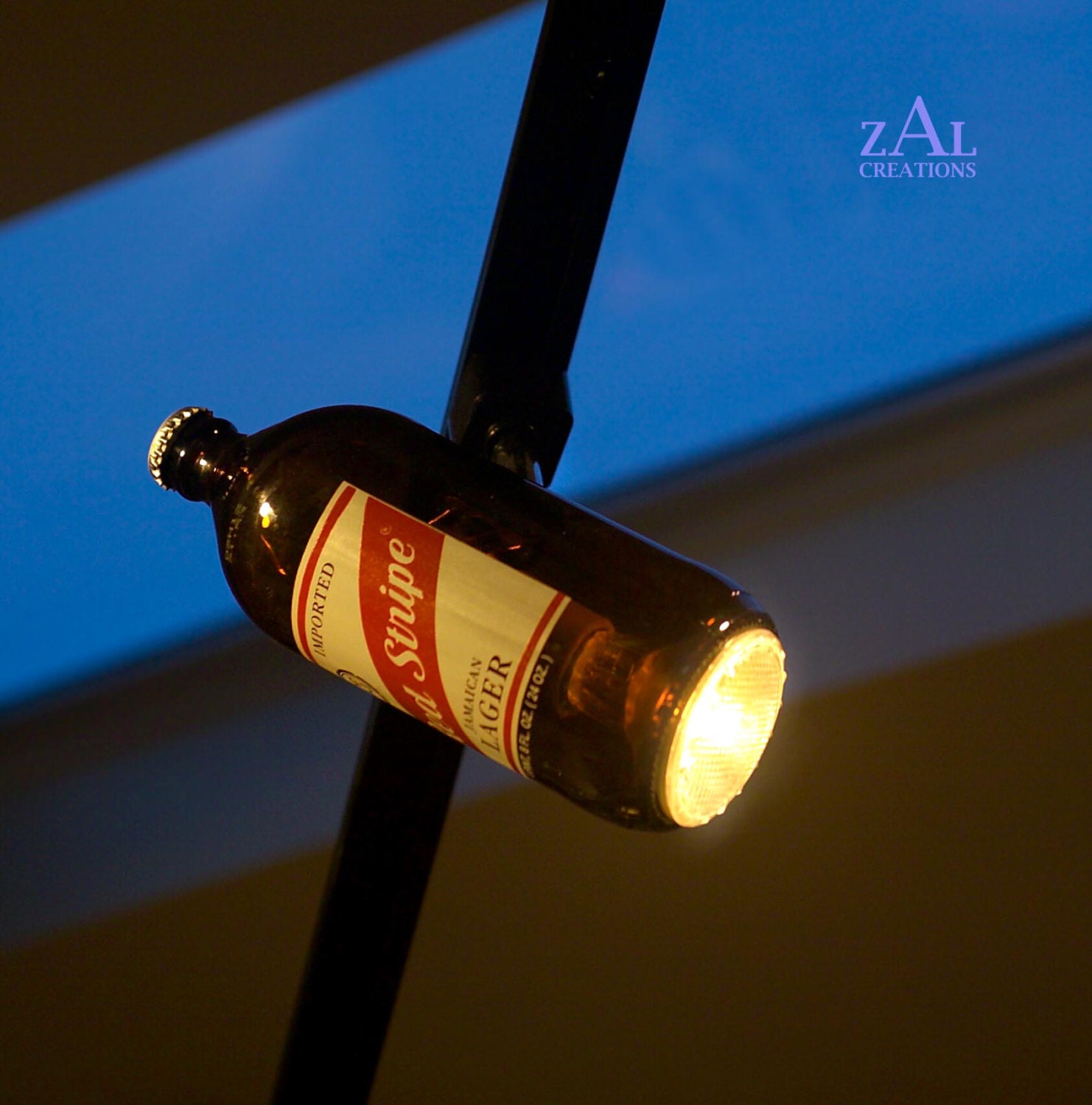 Beer bottle Track light / Track head. Amber glass.