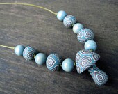 Mens millefiori mushroom pendant necklace in blue, brown and tan with spirals, on thin leather cord with handmade and beads
