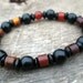 Mens tribal bracelet, horn and wood beads, black and burnt orange, stretch bracelet, natural materials, handmade, upcycled